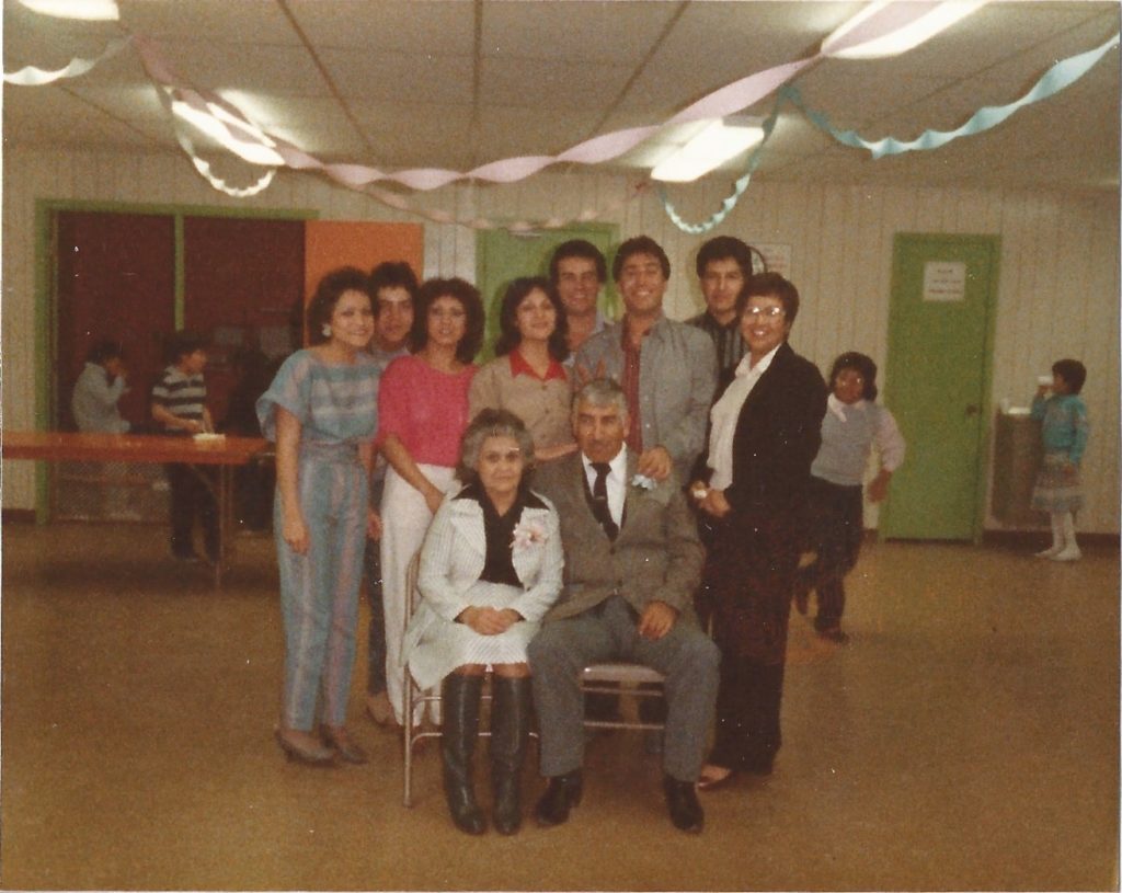 family picture celebrating grandma and grandpa anniverary